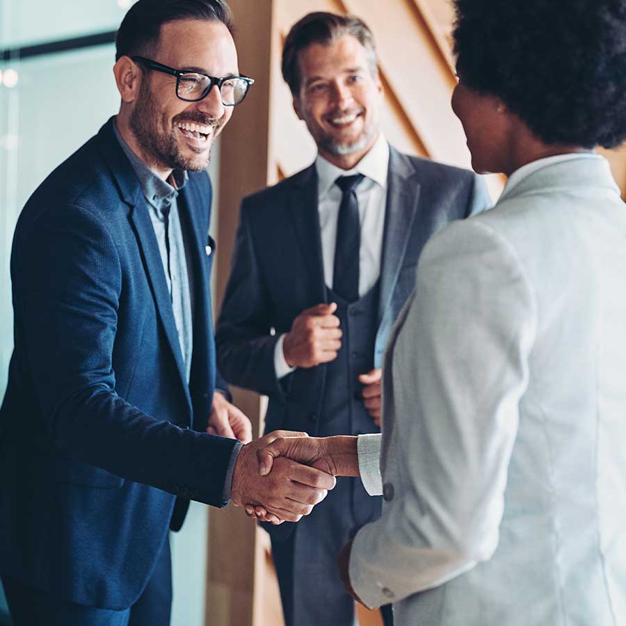Businessman and businesswoman greeting each other on a meeting