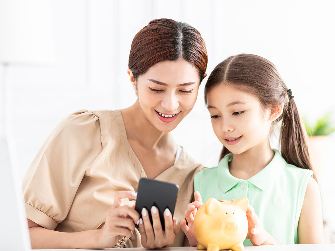 mom and daughter looking on phone
